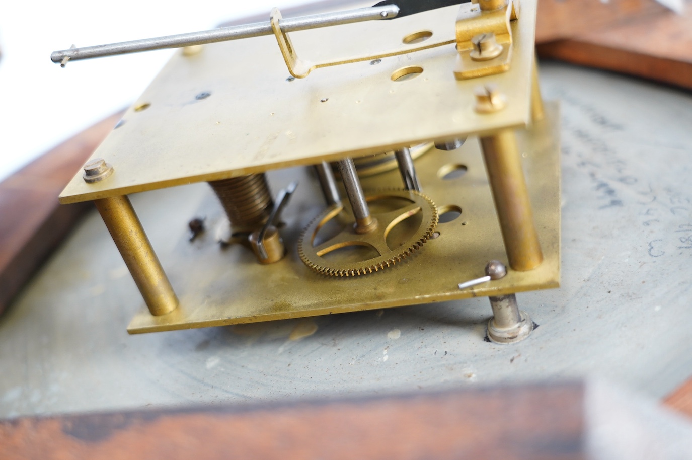 An early 20th century mahogany single fusee Gamleys advertising dial clock, 39cm diameter. Condition - poor to fair